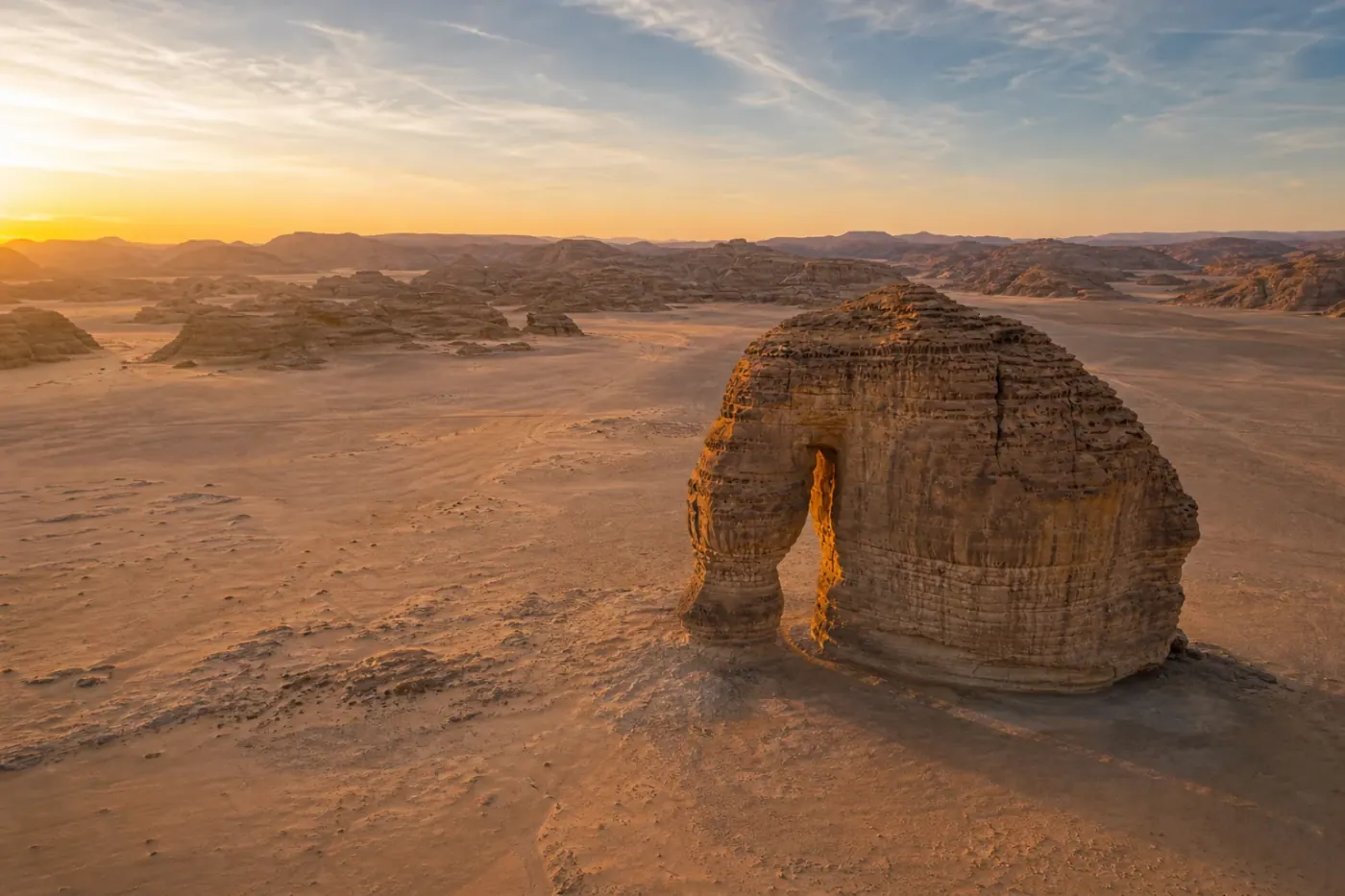 Aerial view of Elephant Rock in AlUla at sunrise.