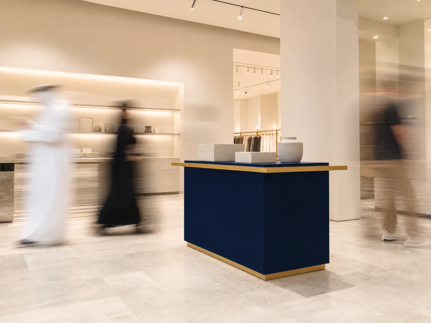 Ghosted shopper motion surrounding a sharp unbranded display in a retail gallery.